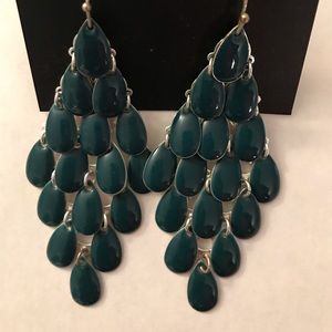 Green dangling pair of earrings